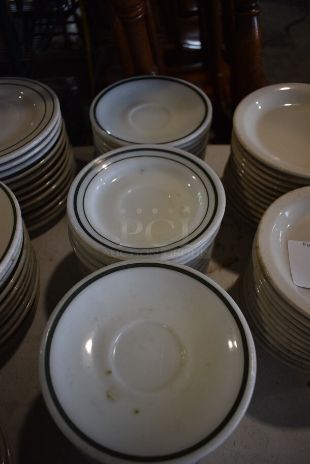 53 White Ceramic Saucers w/ Green Lines on Rim. 6x6x1. 53 Times Your Bid! - Image 4 of 4