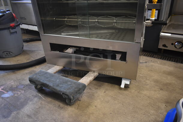 BRAND NEW SCRATCH AND DENT! 2022 Southwood RG7-NAT Stainless Steel Commercial Natural Gas Powered 7 Spit Rotisserie Oven.  - Image 3 of 9