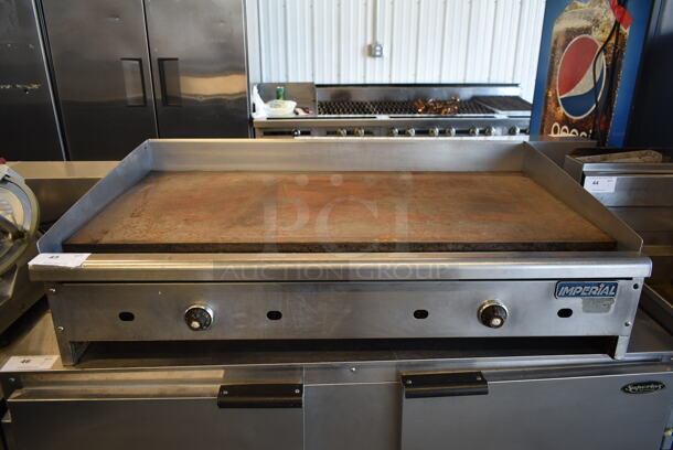 Imperial Stainless Steel Commercial Countertop Natural Gas Powered Flat Top Griddle.  - Image 1 of 9
