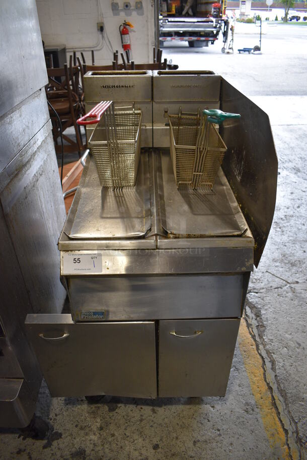Pitco Frialator 7S-C Stainless Steel Commercial Floor Style Natural Gas Powered 2 Bay Deep Fat Fryer w/ 2 Metal Fry Baskets and Right Side Splash Guard on Commercial Casters. 20x32x47