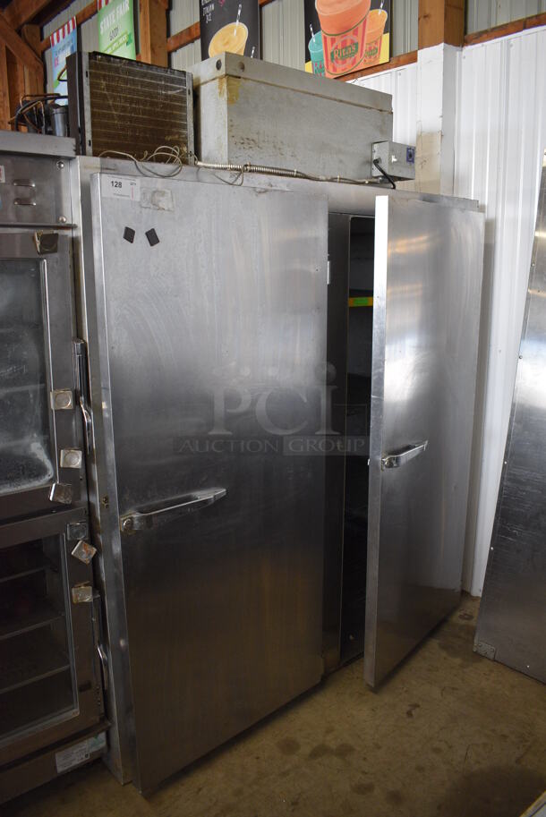 2011 Manitowoc Model L4-4002VRHPFS Stainless Steel Commercial 2 Door Reach In Cooler w/ Metro Green Finish 4 Tier Shelving Unit. Right Door Does Not Stay Closed. 115 Volts, 1 Phase. 67x34x85. Tested and Powers On But Does Not Get Cold