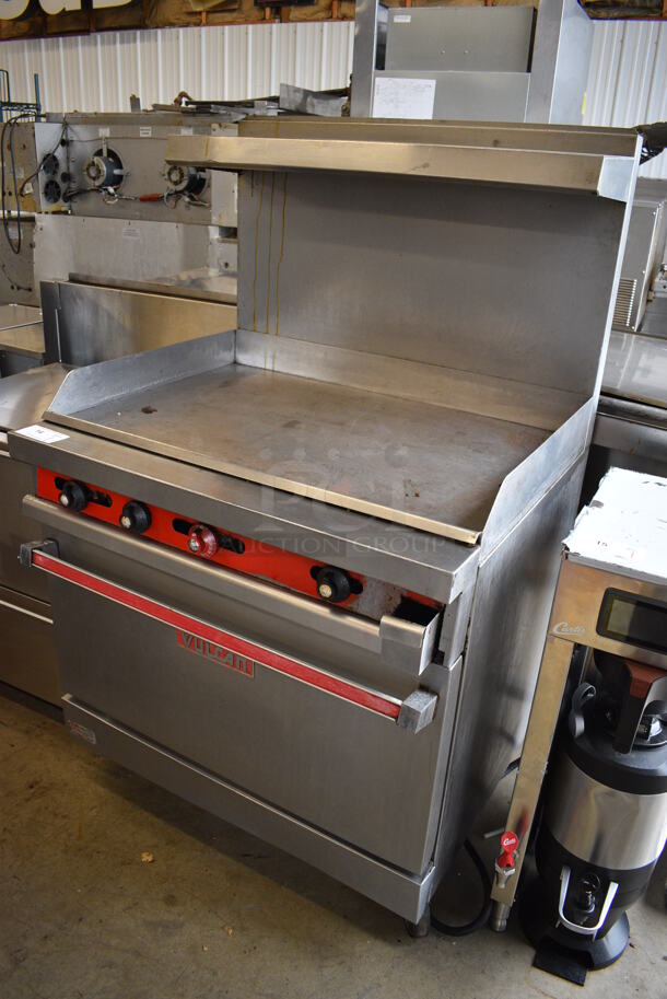Vulcan Model 36XTL-561 Stainless Steel Commercial Natural Gas Powered Flat Top Griddle w/ Oven, Over Shelf and Back Splash on Commercial Casters. 36x31x60