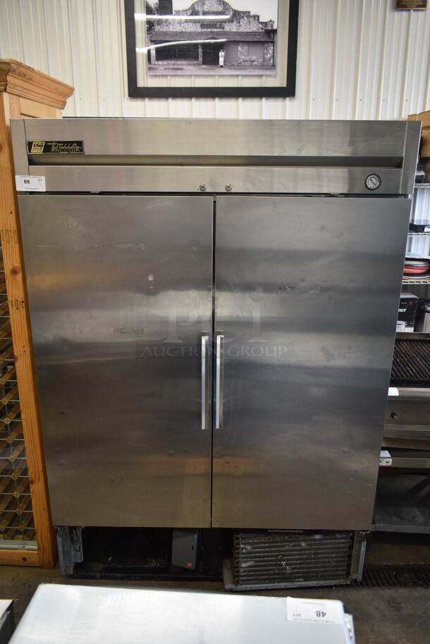 True T-49F Stainless Steel Commercial 2 Door Reach In Freezer w/ Poly Coated Shelves. 115 Volts, 1 Phase. Tested and Powers On But Does Not Get Cold