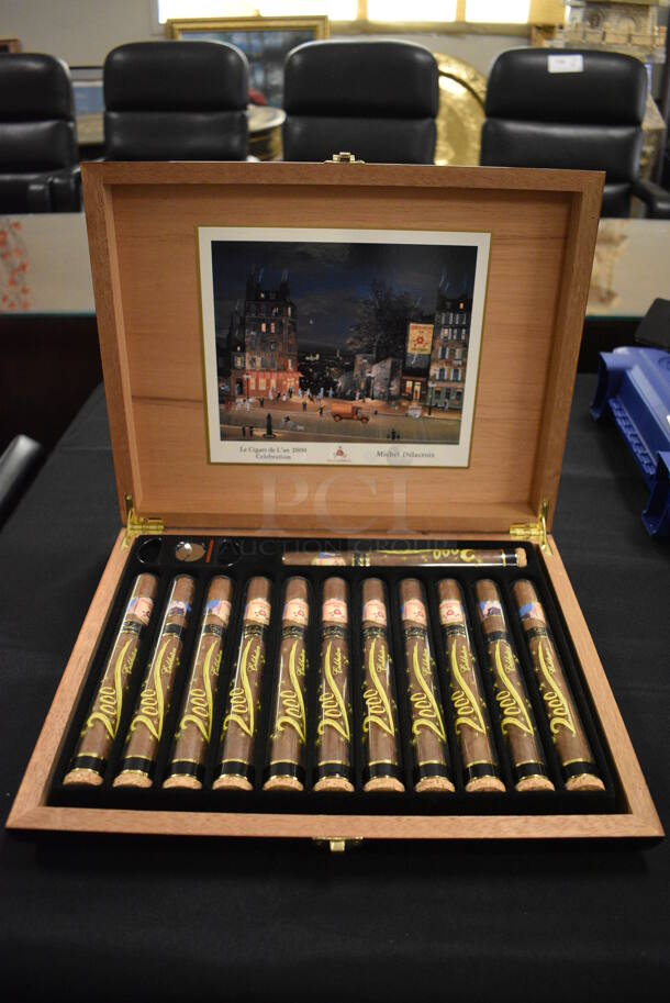 Wooden Box of 12 Montecristos w/ Cigar End Cutter and picture of Le Cigare de L'an 2000 Celebration by Michel Delacroix On Interior of Lid. 
