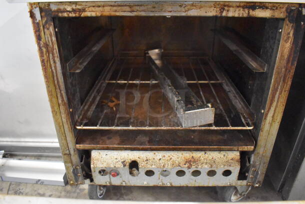 Stianless Steel Commercial Natural Gas Powered 4 Burner Range w/ Oven, Over Shelf and Back Splash on Commercial Casters. Oven Door Needs To Be Reattached. 24x32x57 - Image 6 of 6