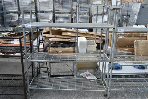 Gray Metal 3 Tier Shelving Unit. BUYER MUST DISMANTLE. PCI CANNOT DISMANTLE FOR SHIPPING. PLEASE CONSIDER FREIGHT CHARGES.