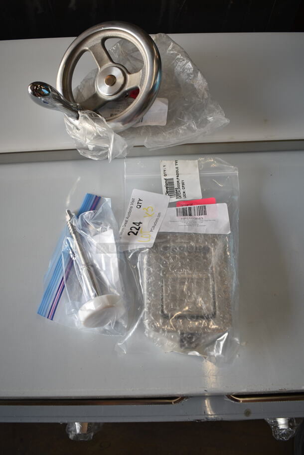 3 BRAND NEW SCRATCH AND DENT! Items; HPS103643 Cleveland S103643 Latch;Door;Paddle Type Service, HPKE52752 Cleveland KE52752 Valve Piston;Td2 Prior 36892, HPKE6039041 Cleveland KE603904-1 Handwheel; Mt T1 Modified. 3 Times Your Bid! - Image 1 of 5