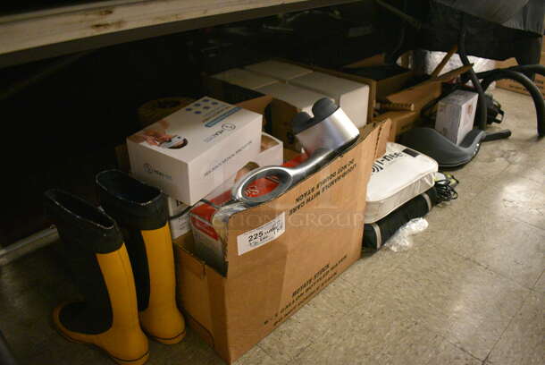 ALL ONE MONEY! Lot of Various Items Under Table Including Rain Boots, Back Massager, Lumbar Massager and Aerosol Cans