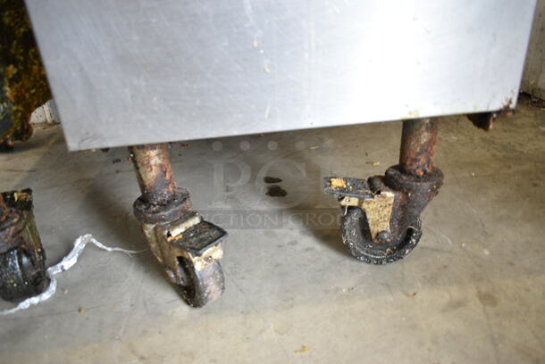 Pitco Frialator SG14 Stainless Steel Commercial Floor Style Natural Gas Powered Deep Fat Fryer w/ 2 Metal Fry Baskets on Commercial Casters. 110,000 BTU.  - Image 4 of 6