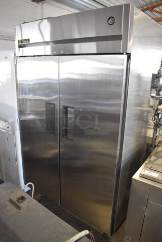 2016 True TG2R-2S Stainless Steel Commercial 2 Door Reach In Cooler w/ Poly Coated Racks on Commercial Casters. 115 Volts, 1 Phase. 52x35x83. Tested and Powers On But Does Not Get Cold