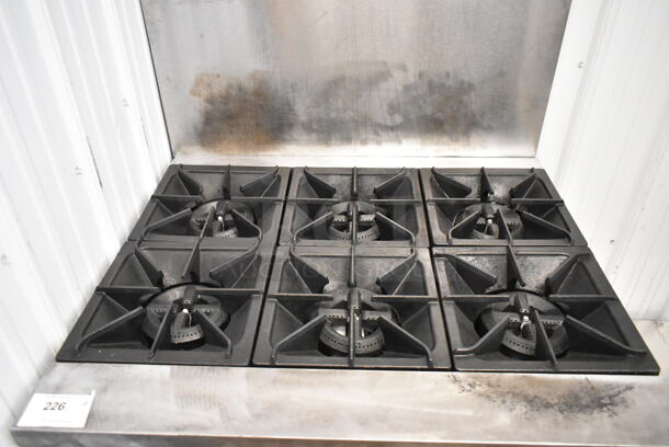 Pantin Stainless Steel Commercial Natural Gas Powered 6 Burner Range w/ Oven and Back Splash.  - Image 2 of 4
