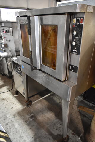 Blodgett BDO-100-G-ES Stainless Steel Commercial Natural Gas Powered Full Size Convection Oven w/ View Through Doors, Metal Oven Racks, Thermostatic Controls and Metal Legs on Commercial Casters. 