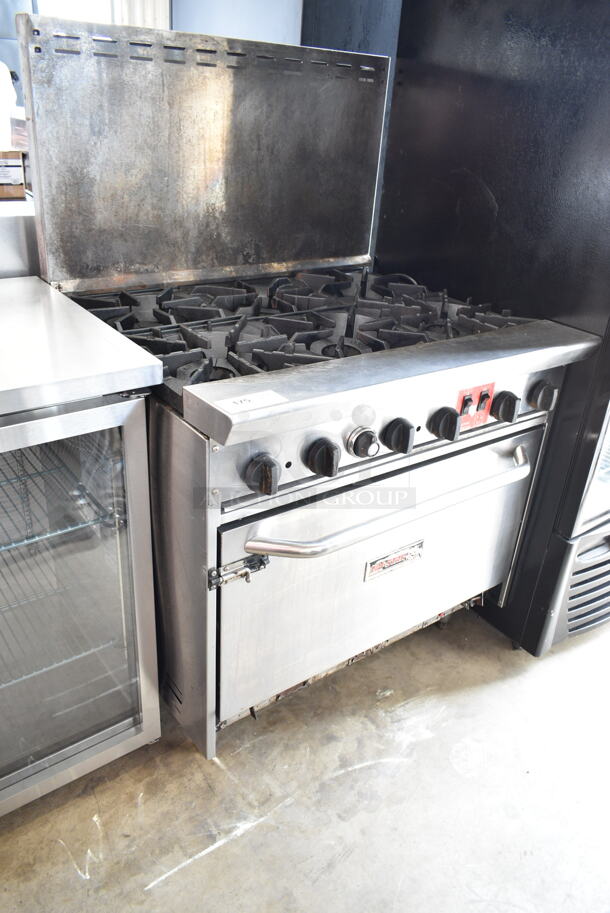 Tri-Star Stainless Steel Commercial Natural Gas Powered 6 Burner Range w/ Convection Oven and Back Splash.  - Image 1 of 6