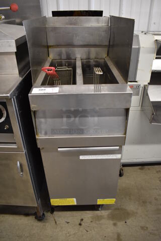 2019 Frymaster SM220GN Stainless Steel Commercial Floor Style Natural Gas Powered Deep Fat Fryer on Commercial Casters w/ Metal Fry Basket and 2 Side Splash Guards. 50,000 BTU. 16x31x47
