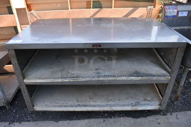 Stainless Steel Commercial Table w/ 2 Metal Under Shelves. 56x30x34.5