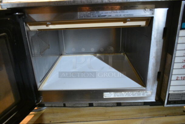 Sharp R-23GT Stainless Steel Commercial Countertop Microwave Oven. 120 Volts, 1 Phase. This Unit Was In Working Condition When the Restaurant Closed. (basement)  - Image 3 of 4