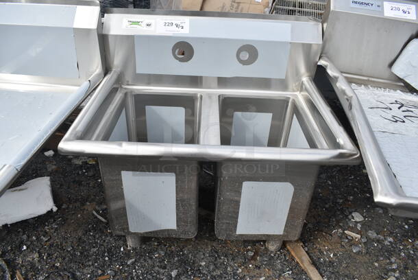 BRAND NEW SCRATCH AND DENT! Regency 600S21014 27" 16-Gauge Stainless Steel Two Compartment Commercial Sink with Galvanized Steel Legs and without Drainboard - 10" x 14" x 12" Bowls. No Legs.   - Image 2 of 6