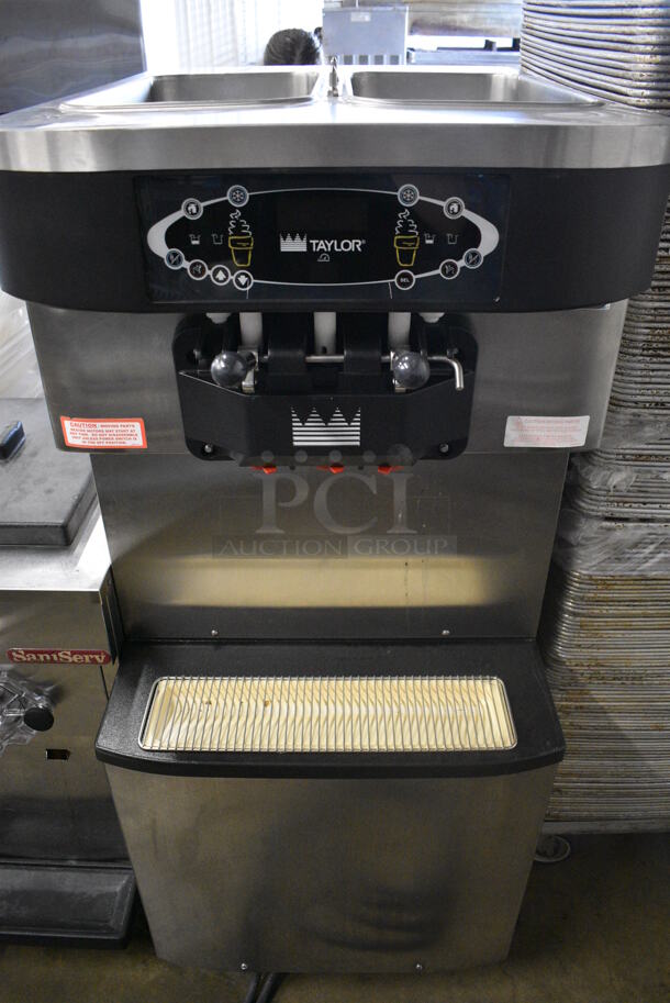 2012 Taylor Model C713-33 Stainless Steel Commercial Floor Style Water Cooled 2 Flavor w/ Twist Soft Serve Ice Cream Machine on Commercial Casters. 208-230 Volts, 3 Phase. 25.5x36x59