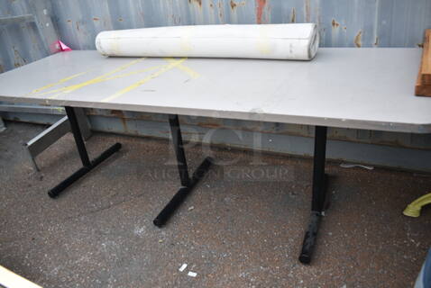 Gray Dining Height Table on 3 Straight Leg Metal Bases. 