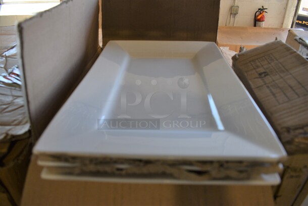 12 BRAND NEW IN BOX! Arcoroc White Ceramic Rectangular Plates. 8x13x1. 12 Times Your Bid!