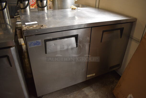 True Model TUC-48F Stainless Steel Commercial 2 Door Undercounter Freezer w/ Commercial Can Opener Mount on Commercial Casters. 115 Volts, 1 Phase. 49x30x36. Tested and Temps at 40 Degrees