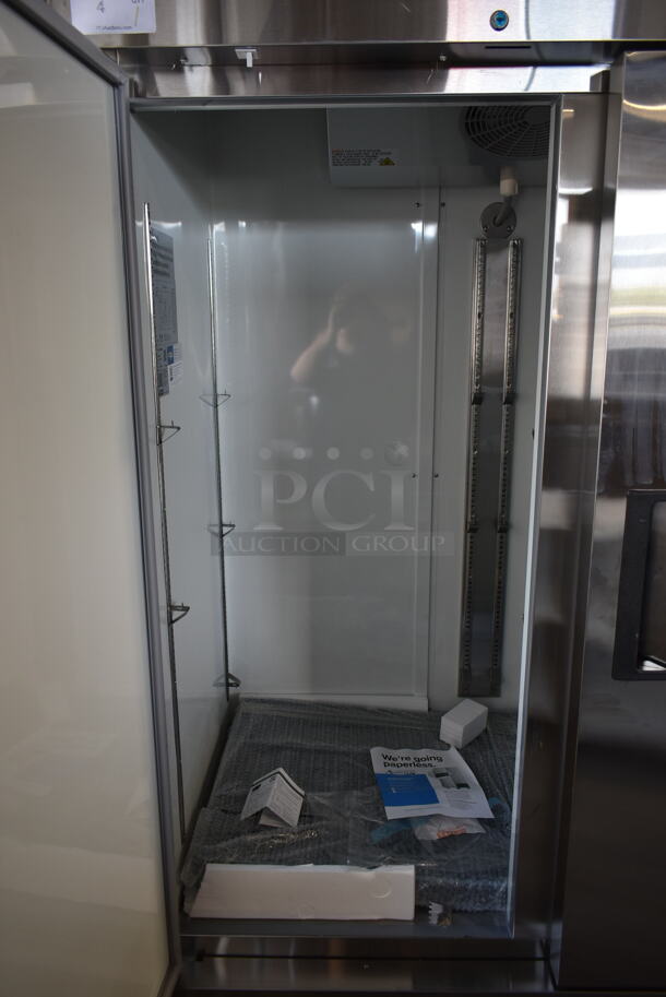 BRAND NEW SCRATCH AND DENT! 2022 Avantco 178A49RHC Stainless Steel Commercial 2 Door Reach In Cooler w/ Poly Coated Racks on Commercial Casters. 115 Volts, 1 Phase. Tested and Working! - Image 4 of 10