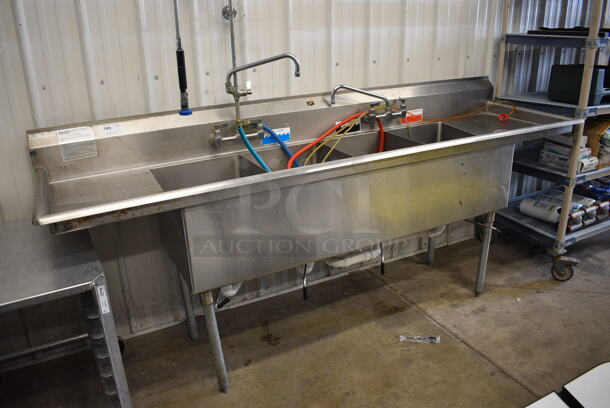 Duke Stainless Steel Commercial 4 Bay Sink w/ Dual Drainboards, Faucet, Handles and Spray Nozzle Attachment. 100x27x43. Bays 16x21x13. Drainboards 16x23x2 - Image 1 of 6