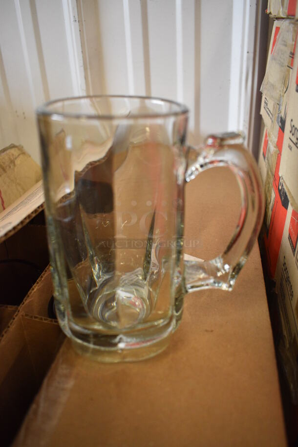 12 BRAND NEW IN BOX! Glass Mugs. 5x3x5.5. 12 Times Your Bid!