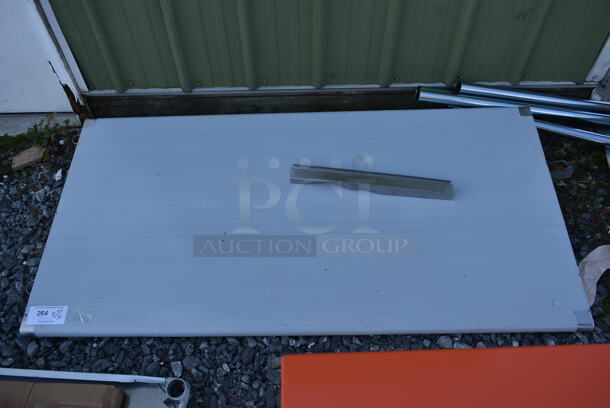 BRAND NEW SCRATCH AND DENT! Stainless Steel Tabletop w/ Under Shelf and Legs. - Image 1 of 3