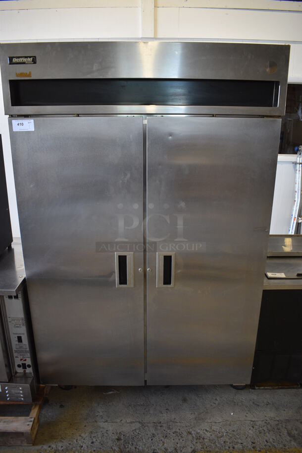 Delfield Model 6151-S Stainless Steel Commercial 2 Door Reach In Freezer on Commercial Casters. 115 Volts, 1 Phase. 50.5x32.5x79.5. Cannot Test Due To Missing Plug Head