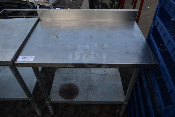 Stainless Steel Commercial Table w/ Back Splash and Metal Under Shelf. - Image 1 of 5