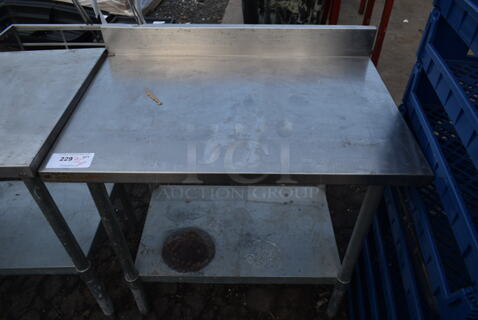 Stainless Steel Commercial Table w/ Back Splash and Metal Under Shelf.
