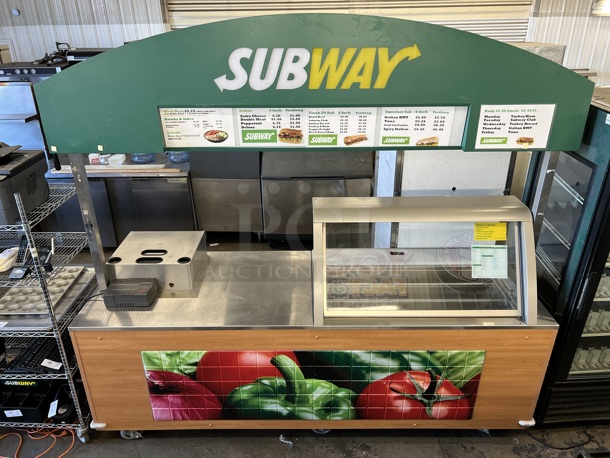 Duke Stainless Steel Commercial Portable Subway Sandwich Make Line Prep Table w/ Lowering Sneeze Guard and Rear 2 Door Cooler on Commercial Casters. 120 Volts, 1 Phase. 108x35x79. Tested and Working!