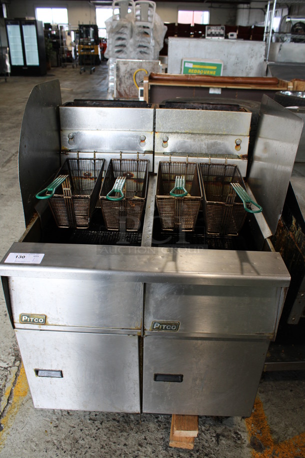 Pitco Frialator Stainless Steel Commercial Natural Gas Powered 2 Bay Fryer w/ 4 Fry Baskets and 2 Side Splash Guards on Commercial Casters. 31.5x35x50