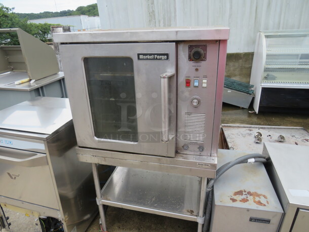 One Market Forge 1/2 Size Convection Oven With 5 Racks, On A Stainless Steel Table With SS Under Shelf. Model# 4200. 230 Volt. 1 Phase. Unable To Test.  30X29X52.5 - Image 1 of 2