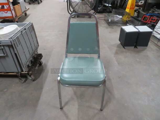 Chrome Stack Chair With Green Cushioned Seat And Back. 5XBID