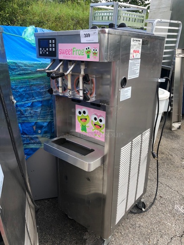 One Stoelting Water Cooled Frozen Yogurt Machine On Casters. #F231-1812YGAD1. 208-240 Volt. 1 Phase. 19X30X58. Casters Crooked. 