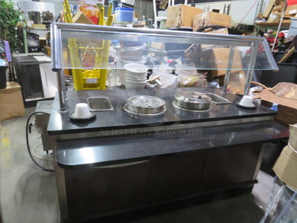 One Soup Station With Under Storage And Black Granite Look Top, With 2 Heated Soup Wells, 2 Spring Loaded Bowl Dispensers, 2 Condiment Holders, Sneeze Guards With A Top Shelf, And A 10 Inch Fold Out Shelf/Line. 68X36X57