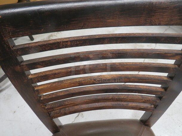 One Wooden Chair In A Dark Finish With A Brown Cushioned Seat.  - Image 2 of 3