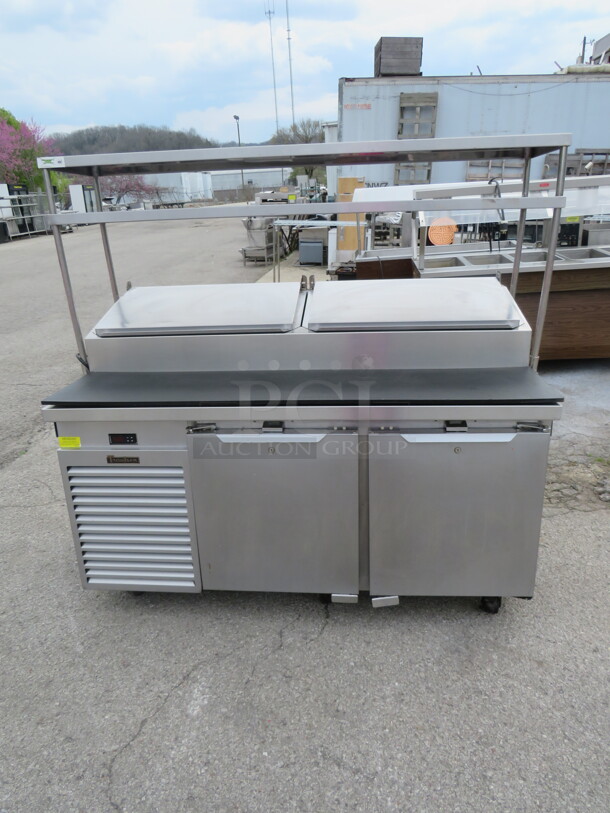 One WORKING Stainless Steel Traulsen 2 Door Refrigerated Prep Table With 2 SS Over Shelves And 4 Racks, On Casters. Model# TS066HT-ZCF03. 66X33X65