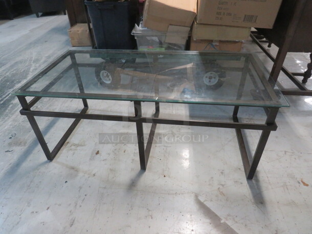 One Metal Coffee Table With A Glass Top. 79X24X24