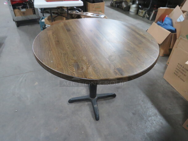 One Round Solid Wooden Table Top On A Pedestal Base. 35.5X35.5X29