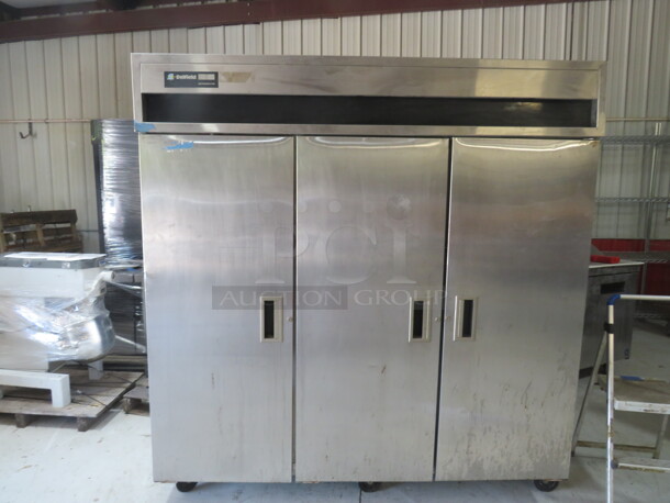 One SS Delfield 3 Door Refrigerator With 11 Racks. 115 Volt. Working NOT Cold. Model# 6076S. 76X33X80 - Image 1 of 3