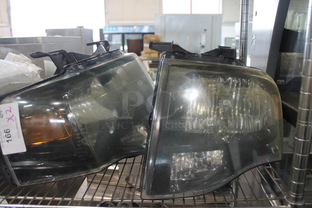 2 BRAND NEW! Ford Headlights. 2 Times Your Bid!