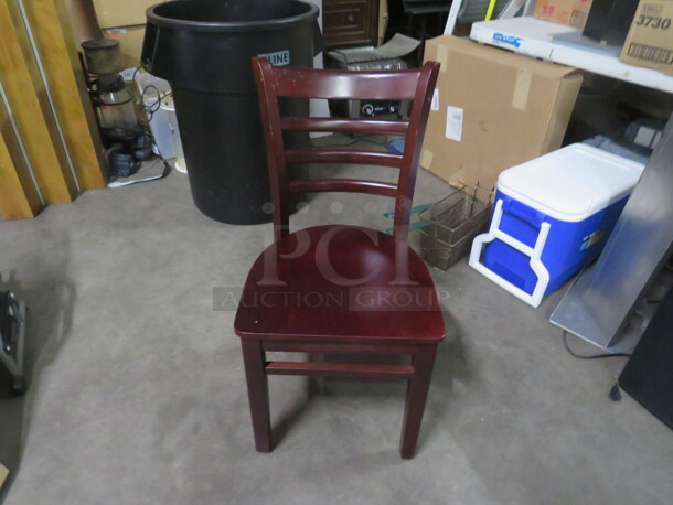 Solid Wooden Chair In A Mahogany Finish. 2XBID. THESE CHAIRS LOOK BRAND NEW!!!! - Image 1 of 4