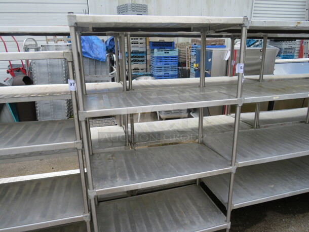 One Metal Shelving System With 4 Shelves. 36X20X63