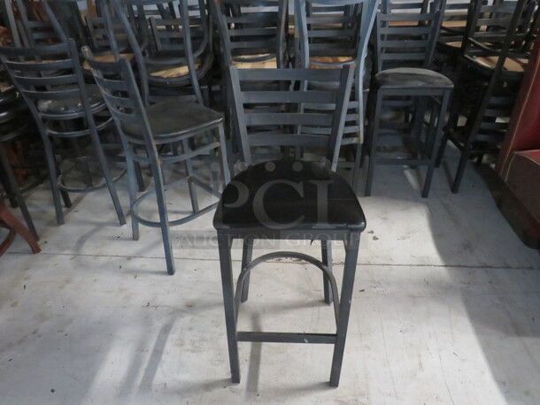 Black Metal Bar Height Chair With Footrest And A Black Cushioned Seat. 2XBID - Image 1 of 4