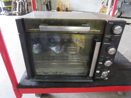 One Cooks Essentials Rotisserie/Toaster Oven. Model# 910500. 120 Volt. 1440 Watt. 18.5X15X14