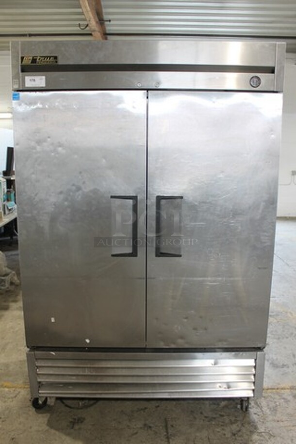 2014 True T-49F ENERGY STAR Stainless Steel Commercial 2 Door Reach In Freezer w/ Poly Coated Racks on Commercial Casters. 115 Volts, 1 Phase. Tested and Working!