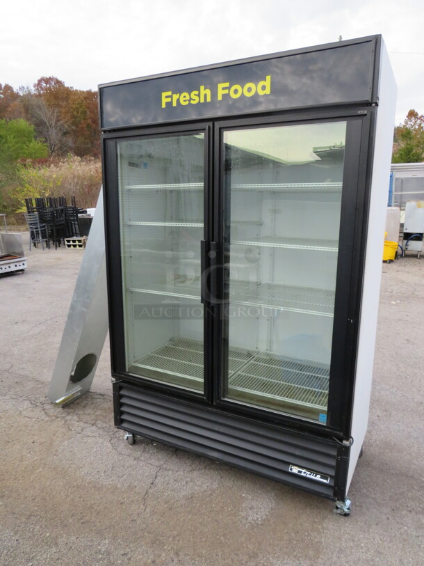 One True 2 Door Glass Display Refrigerator With 8 Racks On Casters. Working When Removed. 115 Volt. Model# GDM-49. 53X30X82 - Image 1 of 2